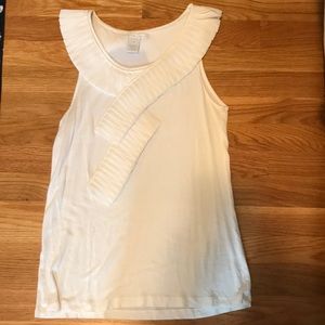 White ruffled blouse.